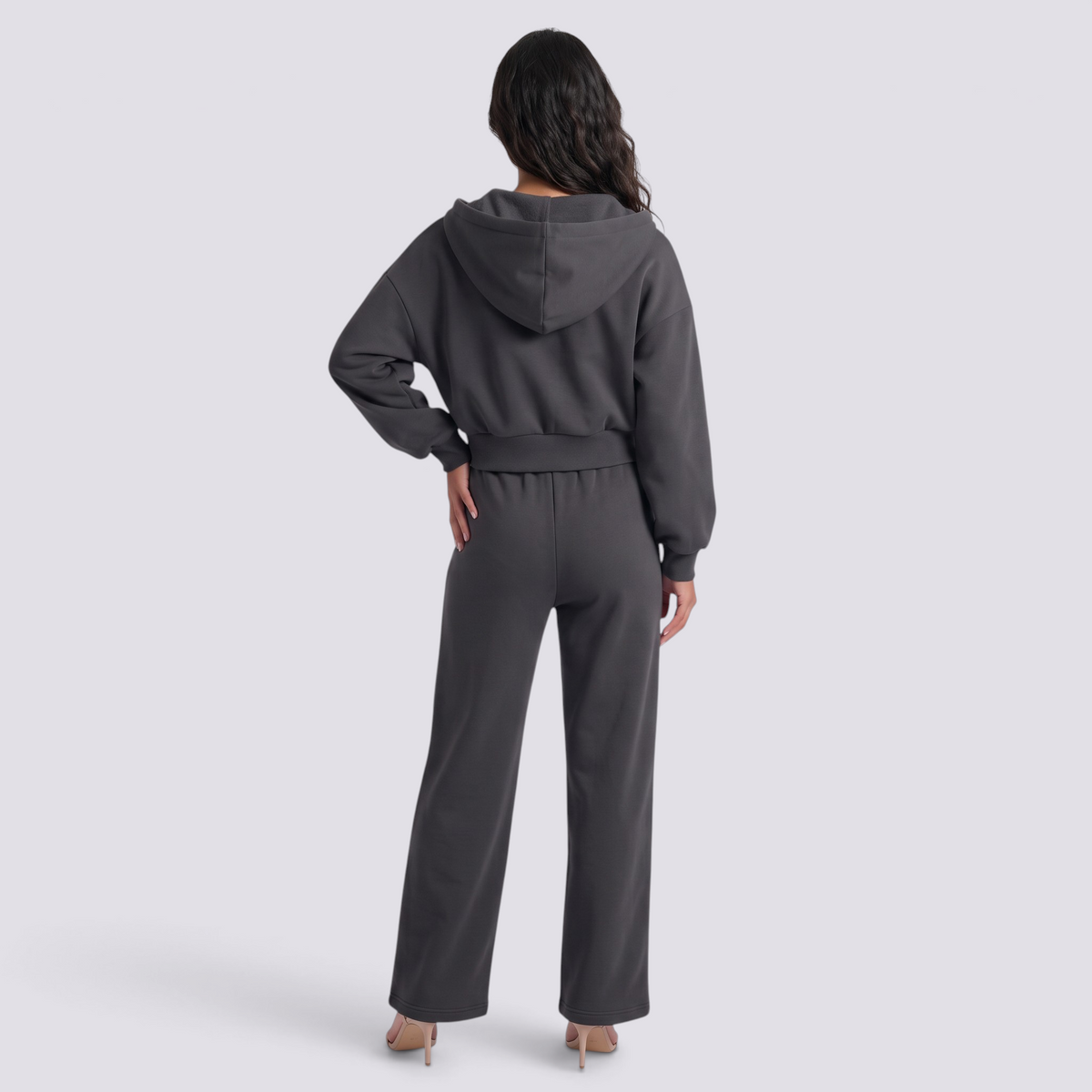 Essyro dark grey oversized hoodie and wide leg trousers set worn by a woman, back view