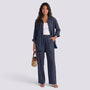 Essyro two-piece set featuring a dark grey loose-fit long-sleeve shirt and matching wide-leg trousers on a model.