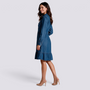 Essyro long-sleeve denim shirt dress with a ruffled hem and button-down front worn by a smiling model