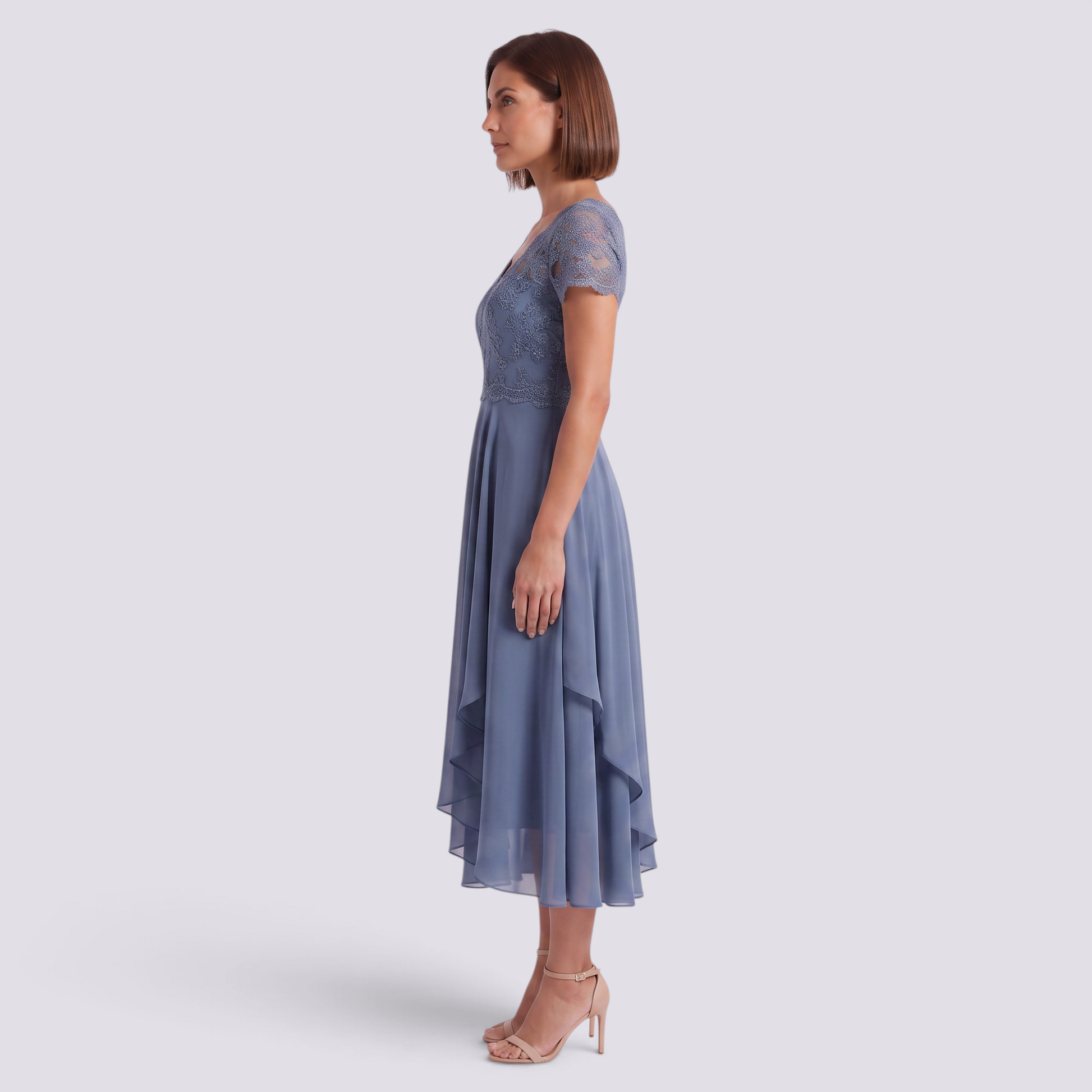 Essyro midi dress in dusty blue with a V-neck, lace bodice, and flowing skirt, worn by a model in profile view.