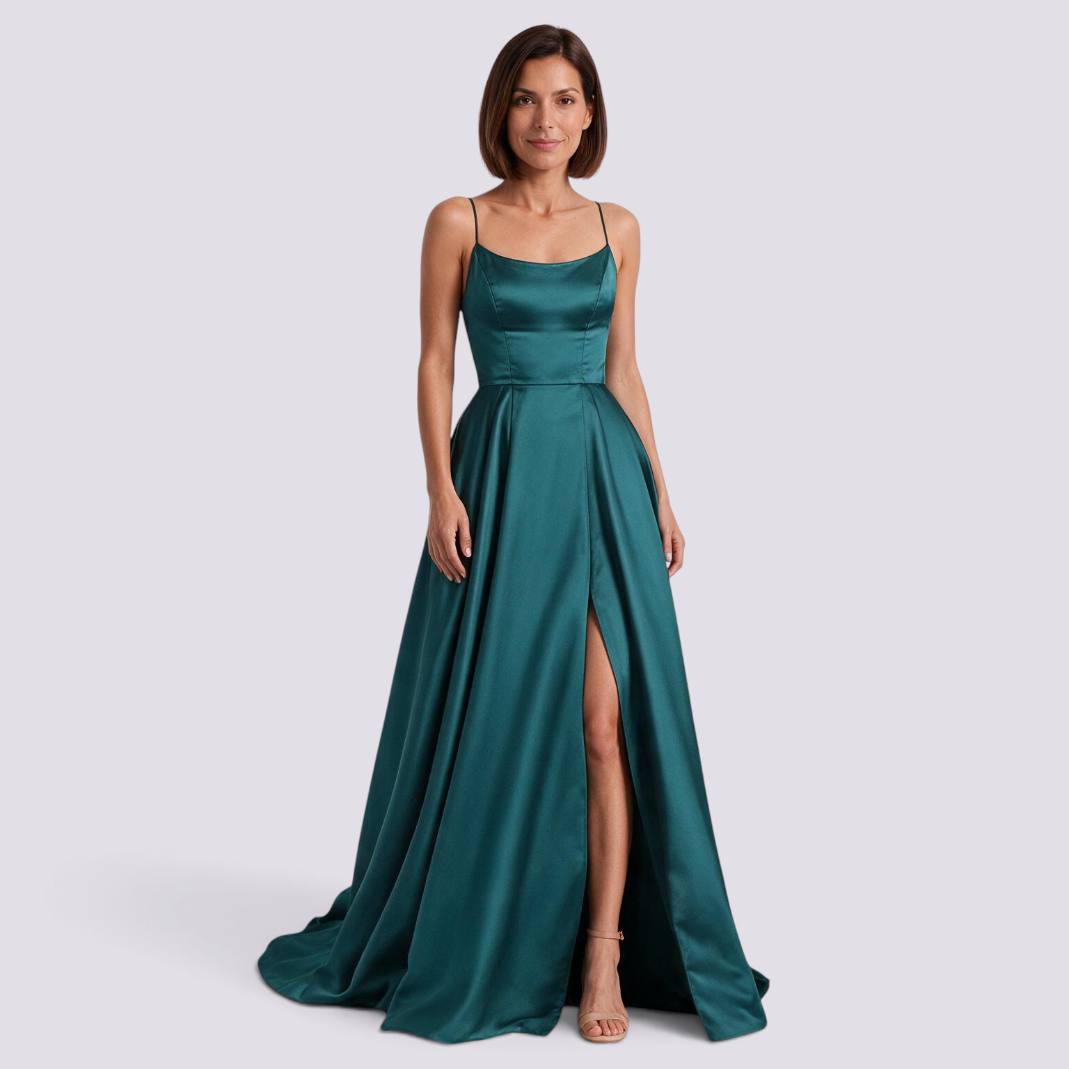 Essyro emerald green floor-length satin evening gown with a fitted bodice, spaghetti straps, and a high leg slit.