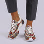 Essyro unisex chunky dad shoes featuring a vibrant woven ethnic pattern, white laces, and a cushioned robust sole.