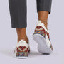 Essyro unisex chunky dad shoes featuring a woven ethnic pattern in red, blue, and yellow on a white base