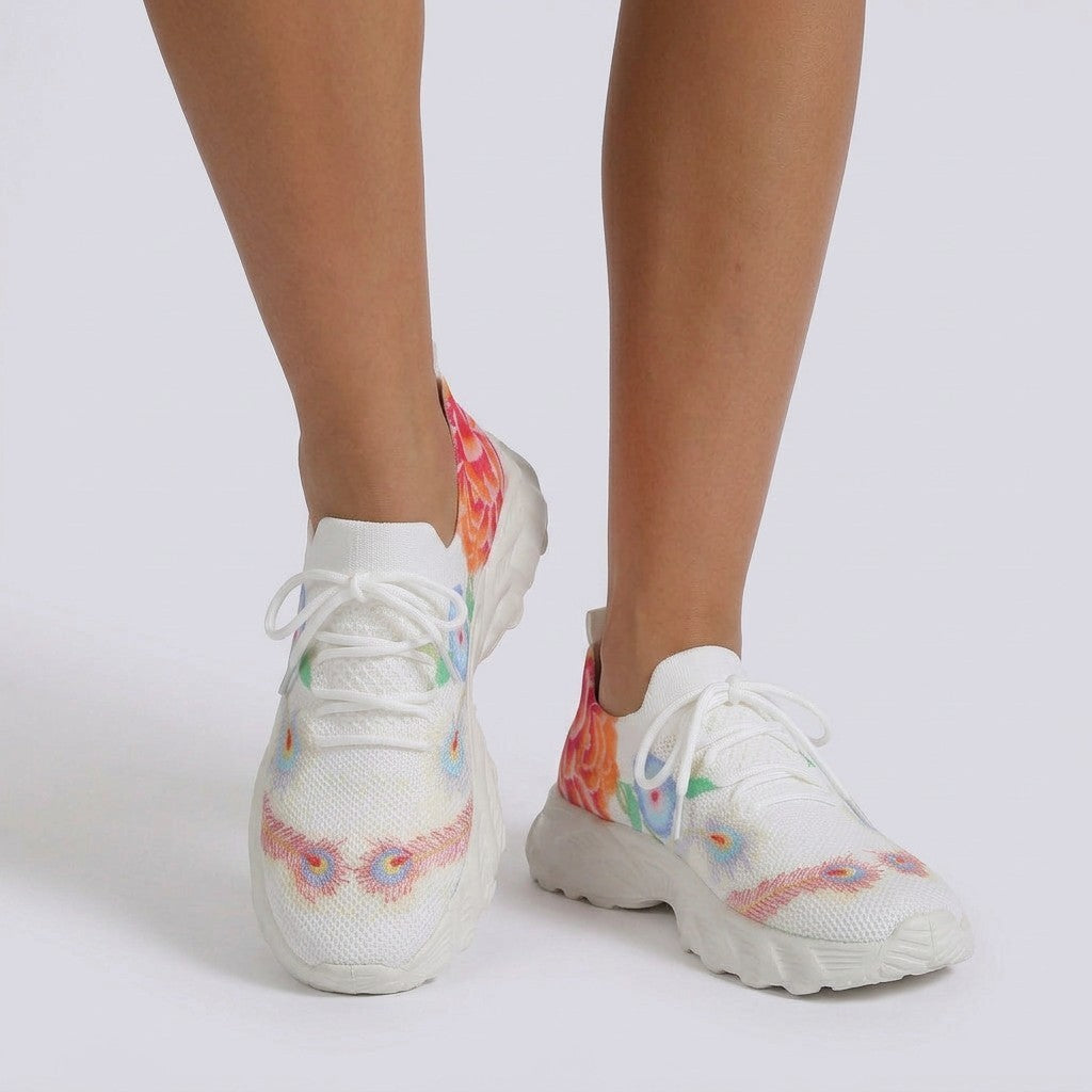 Essyro women's white flying-woven sneakers featuring a colorful floral pattern and comfortable white rubber soles.