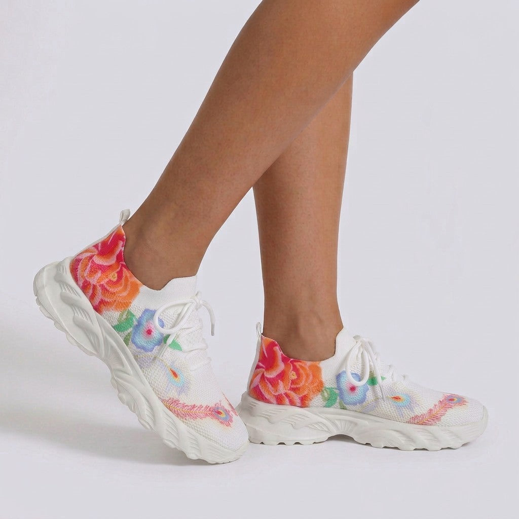 Essyro women's white flying-woven sneakers featuring a vibrant floral print and comfortable white non-slip soles.