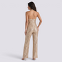 Essyro gold sequin halter neck jumpsuit with wide legs and open back worn by a model on a white background