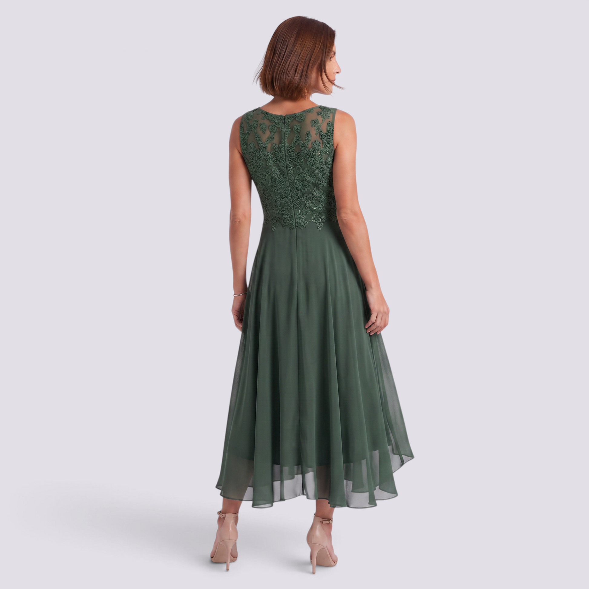 Essyro midi dress in dark green with lace back detail and flowing skirt worn by a woman from the back view