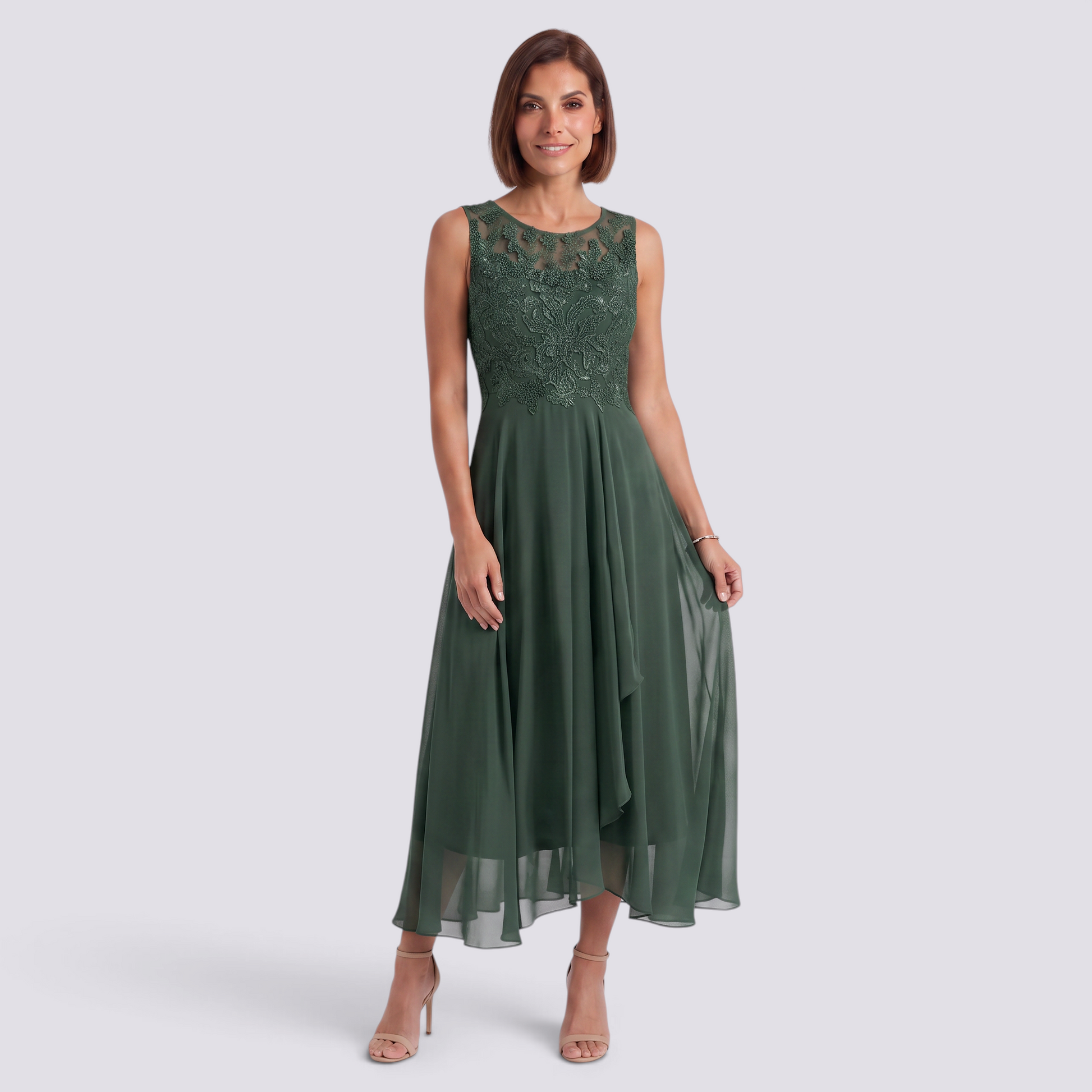 Essyro dark green midi dress with lace bodice and flowing chiffon skirt worn by a woman on a light grey background.