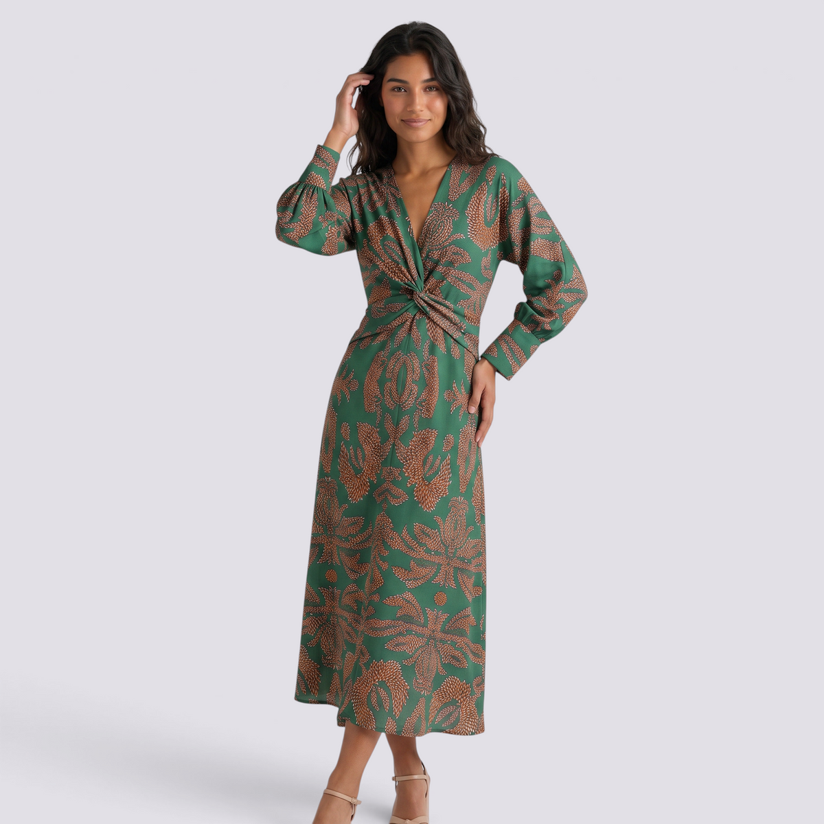 Essyro midi dress in green with artistic brown print, featuring a V-neck, 3/4 sleeves, and a twisted waist detail.
