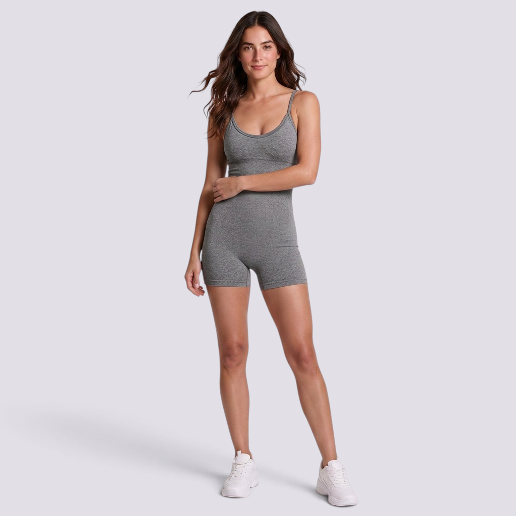 Essyro grey fitted short sports jumpsuit with thin straps worn by a model for yoga and fitness activities