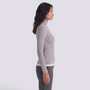 Essyro grey ribbed turtleneck sweater with long sleeves worn by a model in a side profile view.