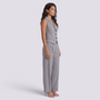 Essyro grey tailored two-piece set featuring a sleeveless vest and matching trousers on a model in profile view