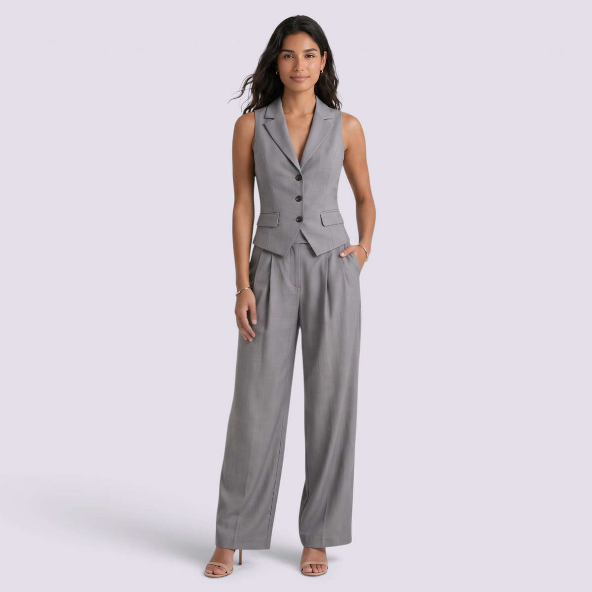 Essyro two-piece grey tailored vest and wide-leg trouser set worn by a model for a sophisticated office look.