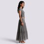 Essyro two-piece set featuring a grey fitted short-sleeve top and a flowing maxi skirt with textured waist detail.