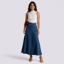 Essyro high-waisted maxi denim skirt with vertical panels worn by a model with a white sleeveless top and heels