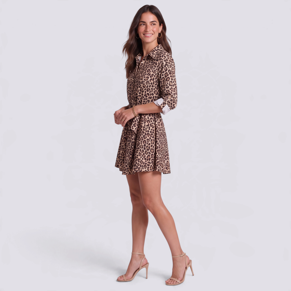 Essyro short leopard print shirt dress with waist tie, gold buttons, and three-quarter sleeves on a smiling model.