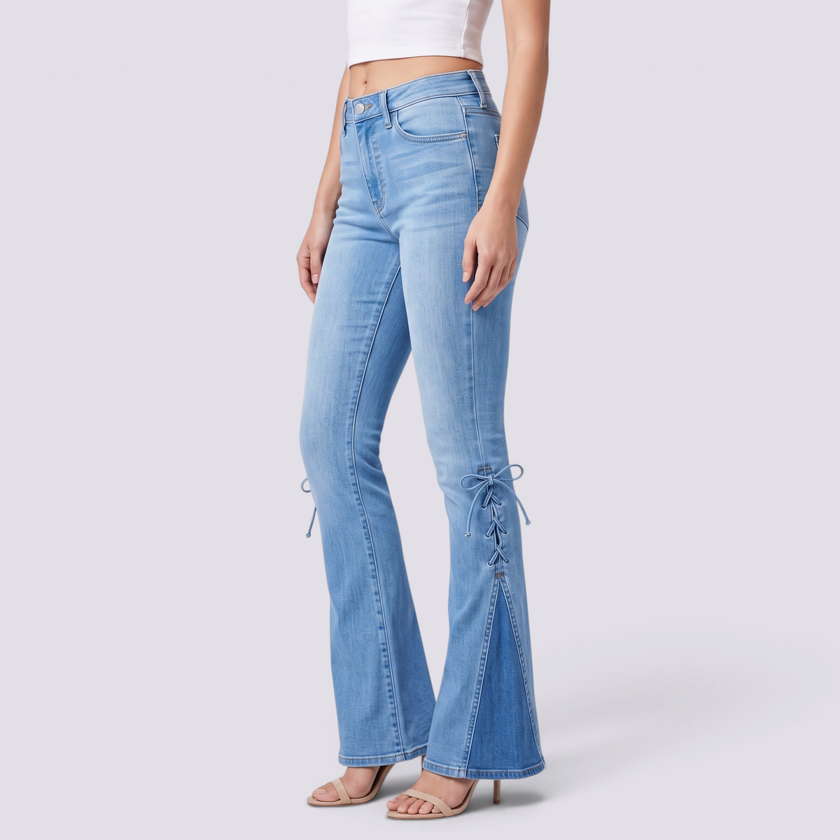 Essyro light blue mid-rise flare jeans for women featuring side lace-up details and triangular hem inserts