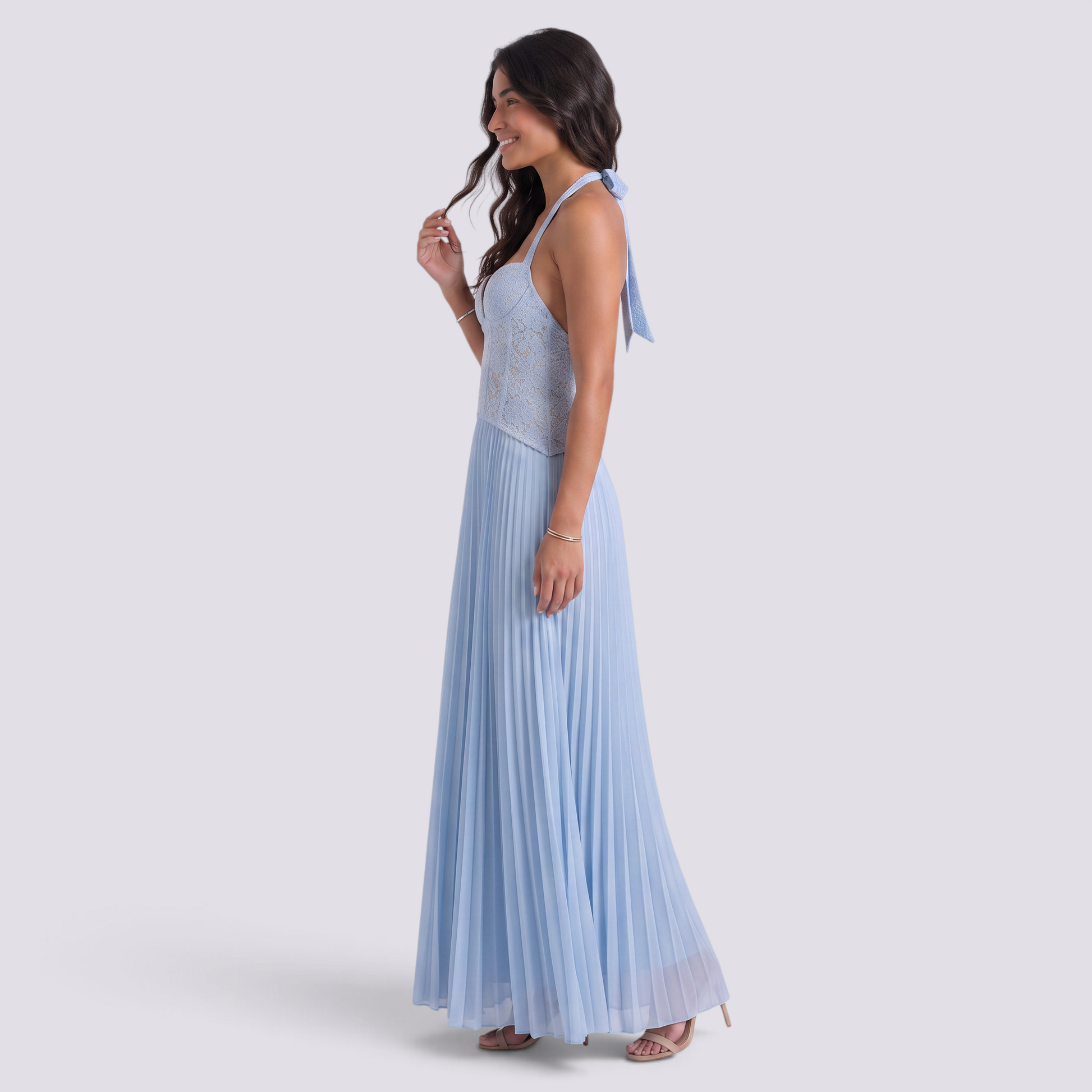 Essyro light blue halter neck maxi dress with a corset bodice and pleated skirt worn by a smiling woman