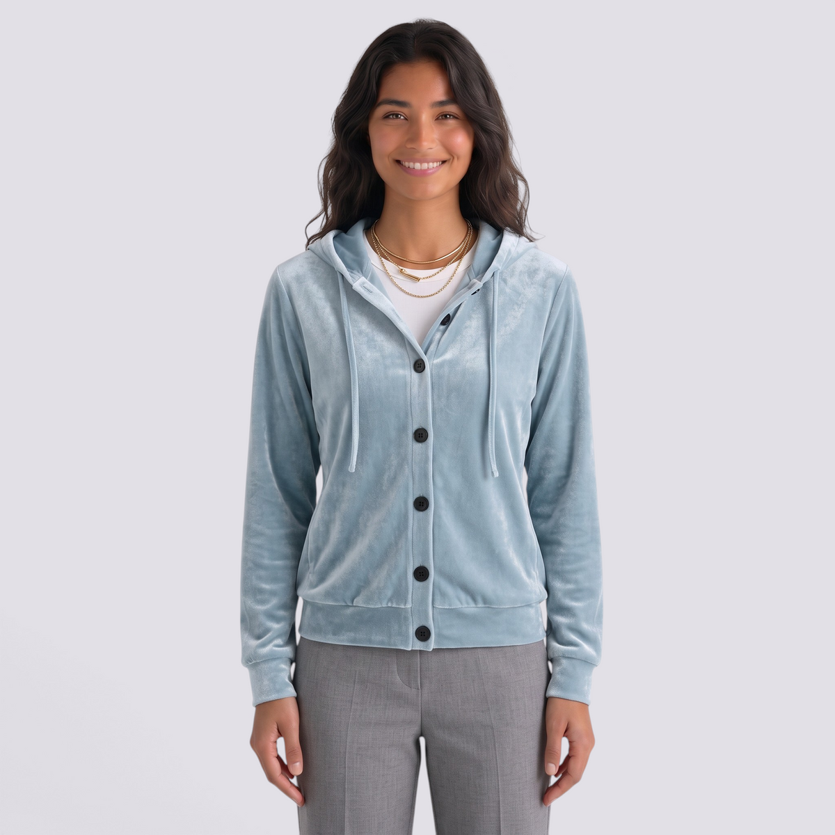 Essyro light blue velvet hooded cardigan with front button closure worn by a smiling woman on a white background