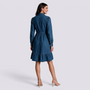Essyro long-sleeve denim shirt dress with a ruffled hem and cinched waist, shown from the back on a female model.
