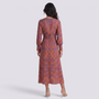 Essyro midi A-line dress in mauve with orange artistic print, featuring 3/4 sleeves and a cinched waist, back view.