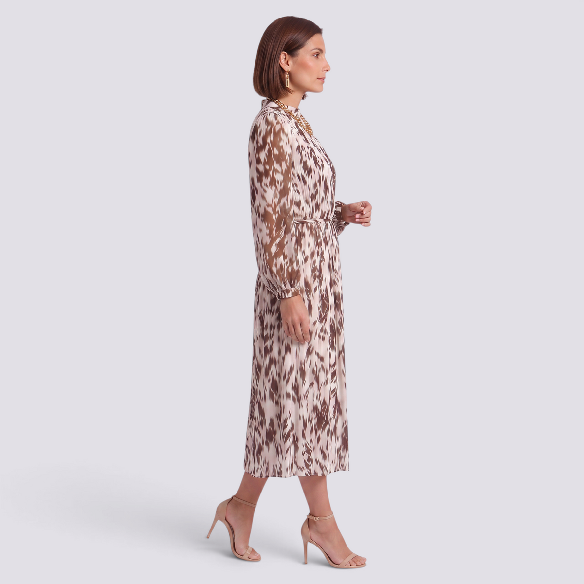 Essyro midi dress with long sleeves, high neck, and brown abstract print, featuring a pleated skirt and waist tie.