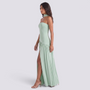 Essyro mint green floor-length halter dress with an asymmetric draped skirt and side slit worn by a model