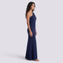 Essyro navy blue floor-length mermaid gown with an asymmetrical one-shoulder neckline worn by a model