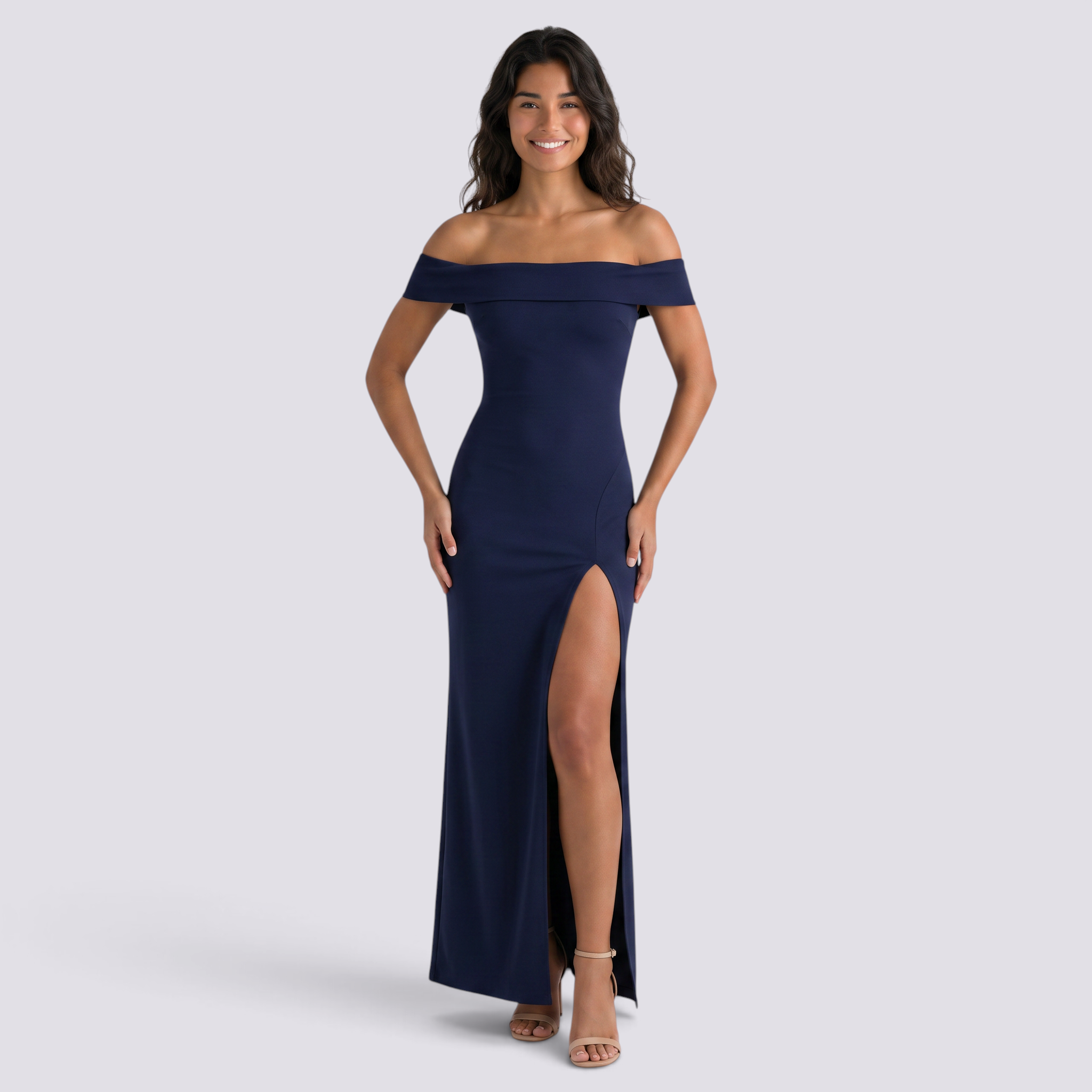 Essyro navy blue bodycon maxi dress with a bardot neckline and side slit worn by a smiling model.