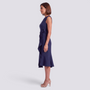 Essyro navy blue sleeveless midi dress with a round neckline and decorative waist bow, side view on a model