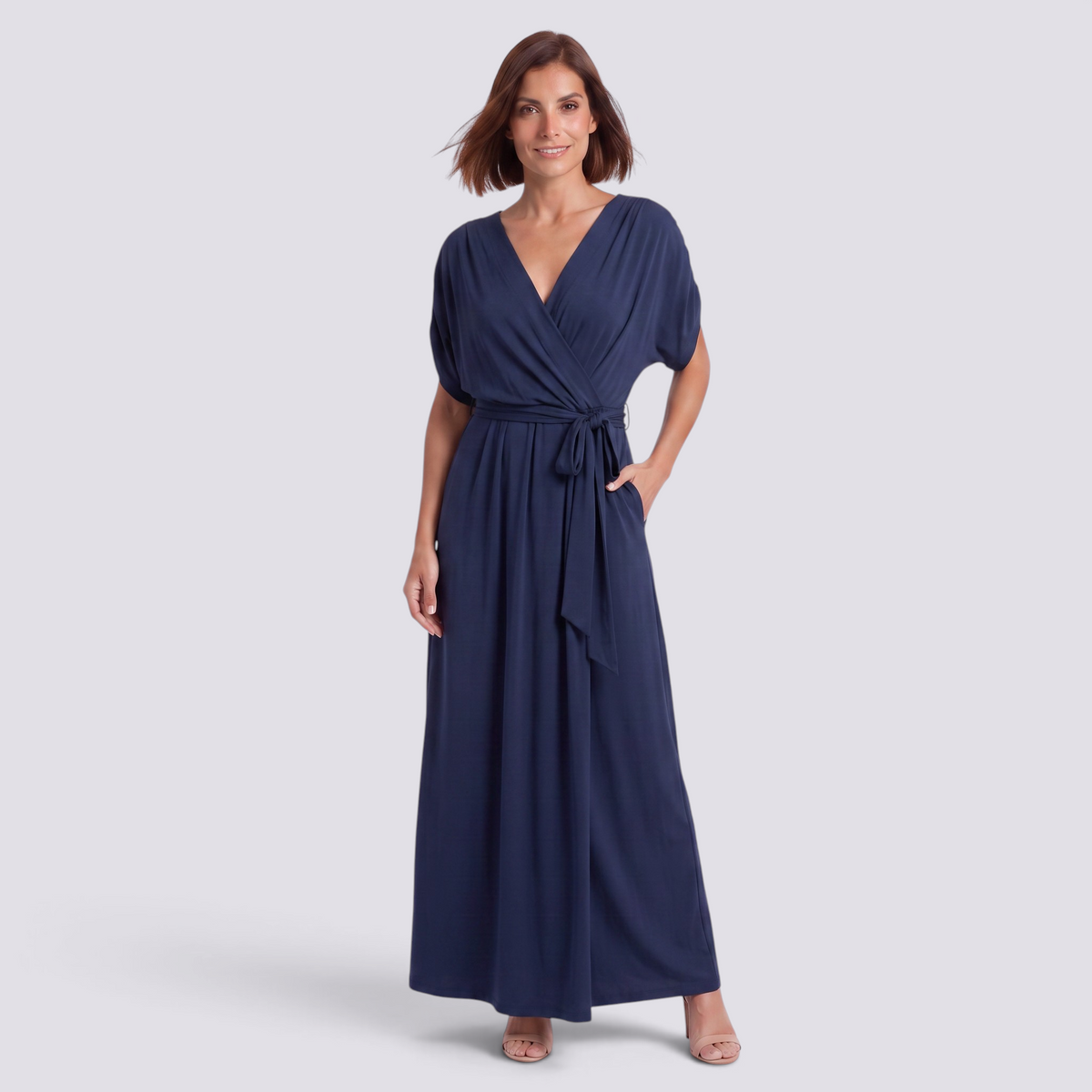 Essyro plus size navy blue floor-length wrap dress with short sleeves and a tie waist on a smiling model
