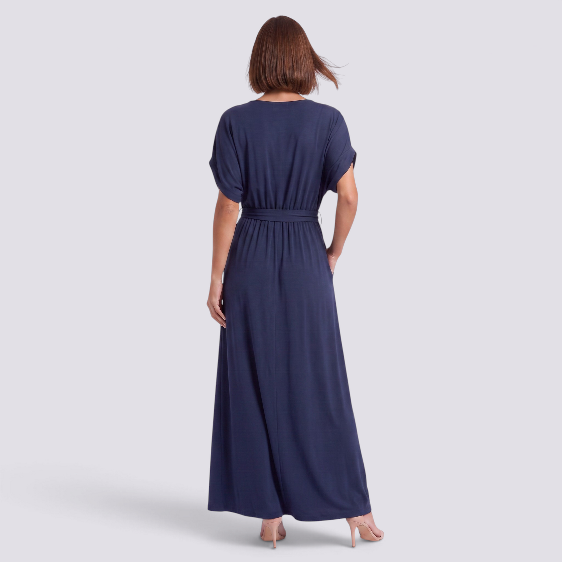Essyro plus size navy blue maxi dress with short sleeves and a belted waist, shown from the back on a model.