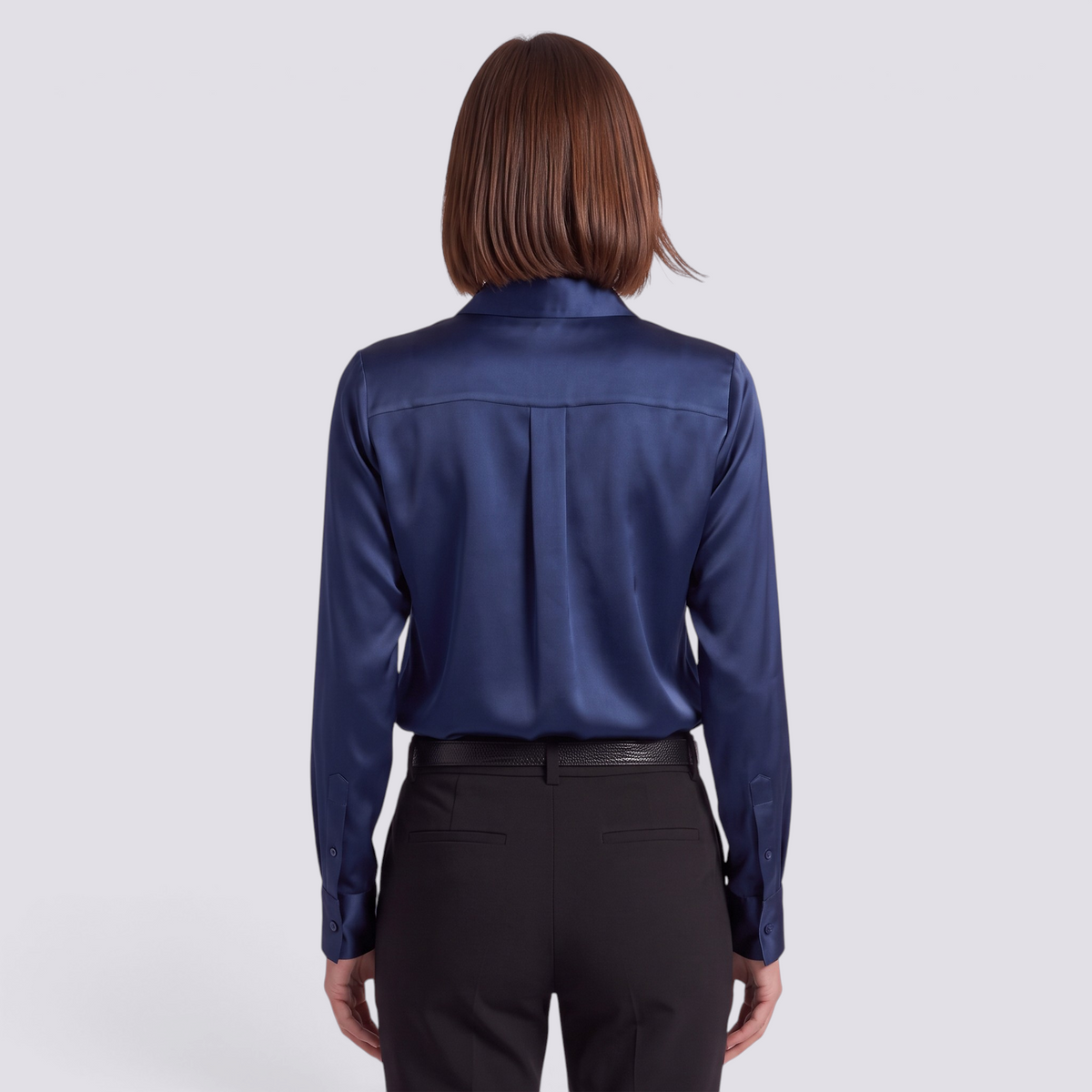 Essyro long-sleeve navy blue satin shirt worn by a woman, back view showing a classic collar and tailored fit.