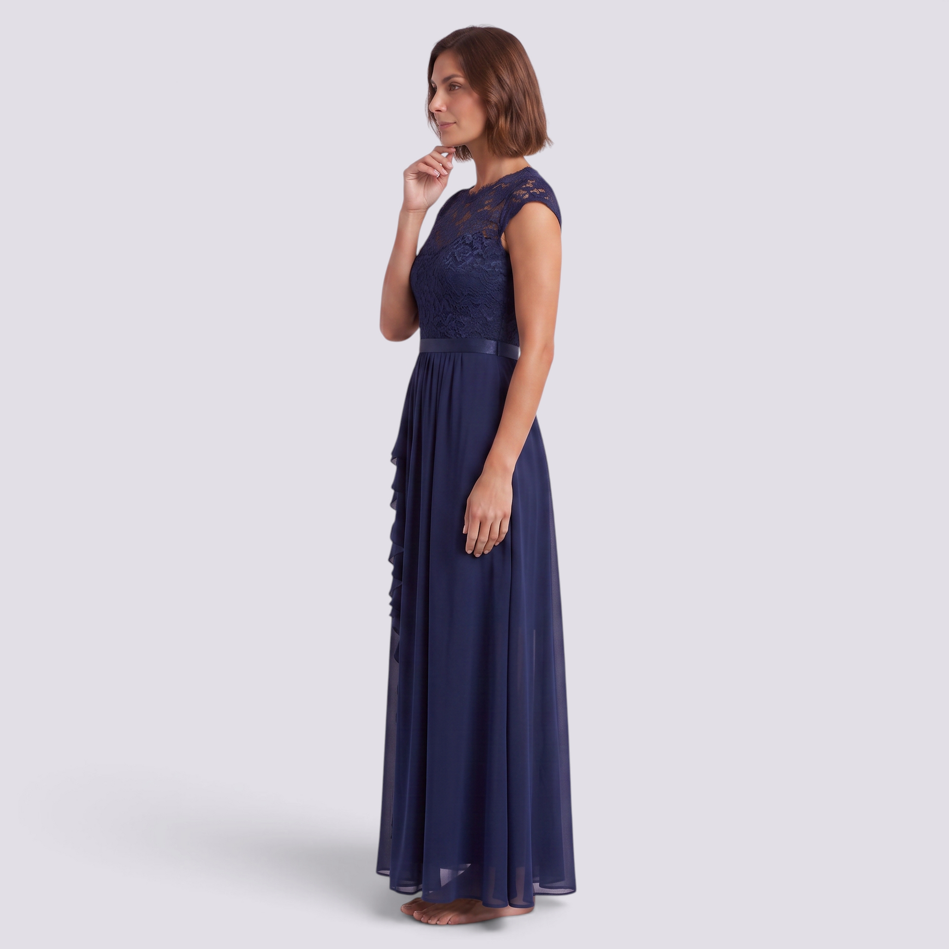 Essyro navy blue lace maxi dress with a high waist and A-line skirt worn by a woman in a side profile view.