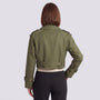 Back view of an Essyro olive green cropped windbreaker jacket with epaulettes and belted cuffs on a woman