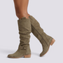 Essyro olive green knee-high slouch boots with a low block heel, suede-effect finish, and ankle strap detail.