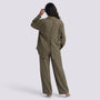 Essyro olive green two-piece set featuring a button-back long-sleeve shirt and wide-leg trousers on a model
