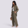 Essyro olive green two-piece set featuring a loose long-sleeve shirt and wide-leg trousers worn by a model.
