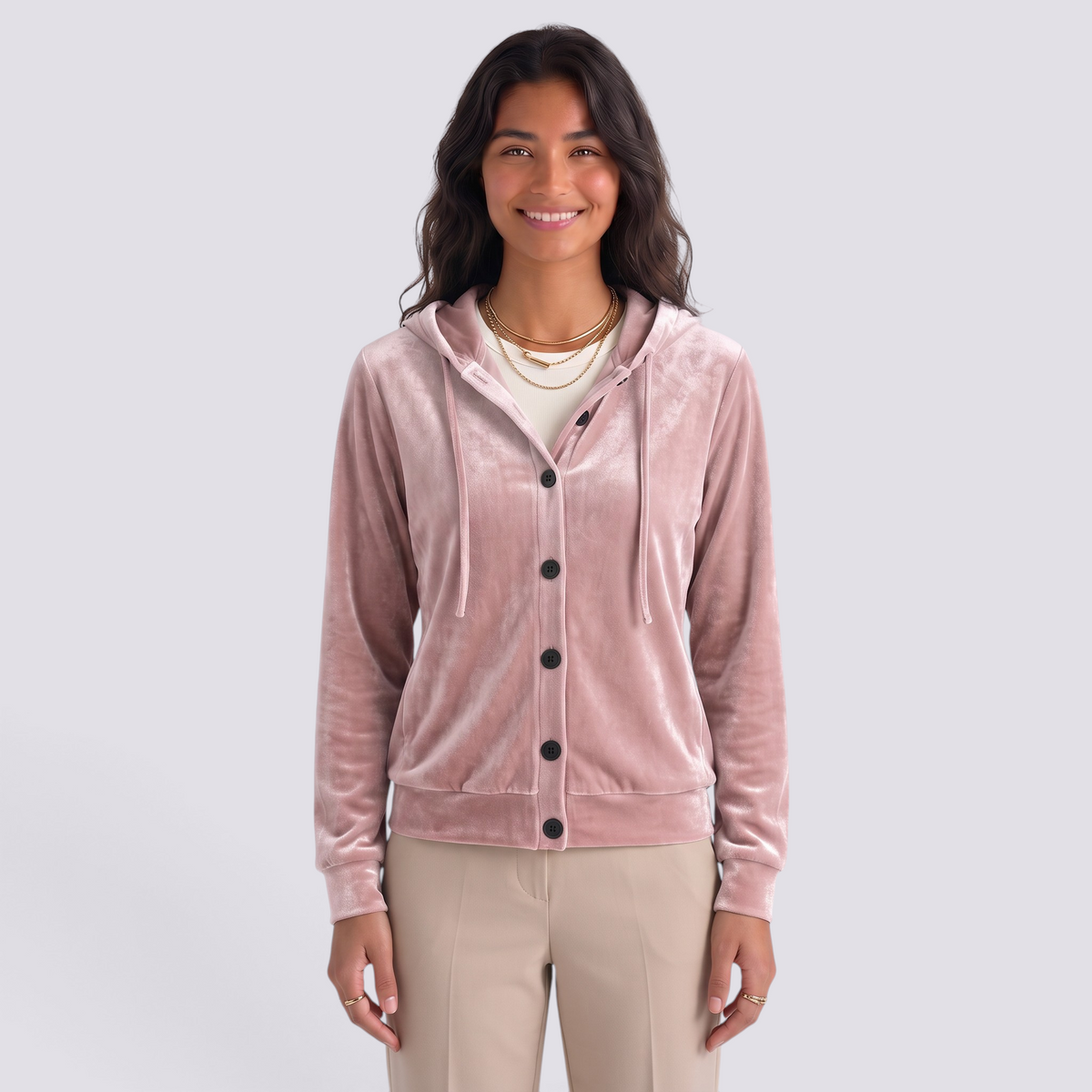 Essyro velvet hooded cardigan in dusty pink with front buttons and drawstring hood worn by a smiling woman
