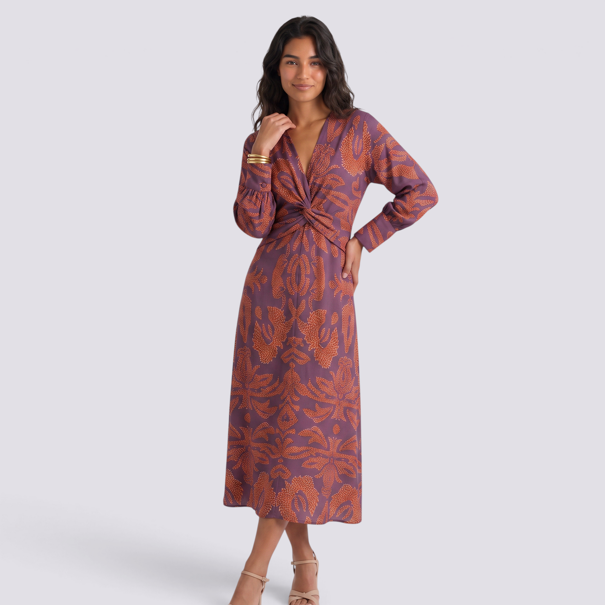 Essyro midi dress in purple with orange artistic print, featuring a V-neck, 3/4 sleeves, and a flattering A-line cut.