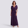 Essyro elegant deep purple floor-length plus size wrap dress with short sleeves and a tie waist on a model