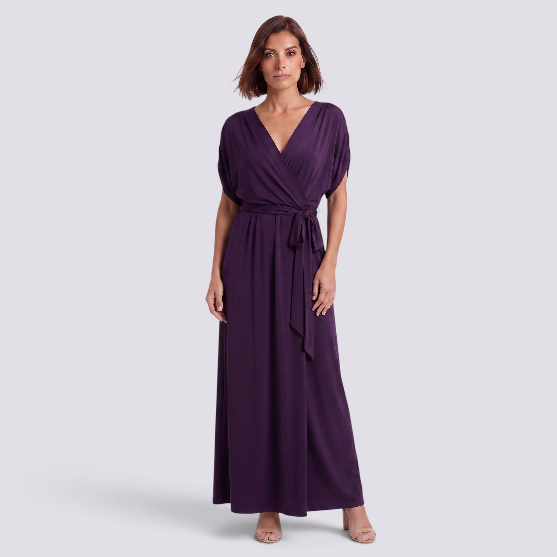 Essyro elegant deep purple floor-length plus size wrap dress with short sleeves and a tie waist on a model