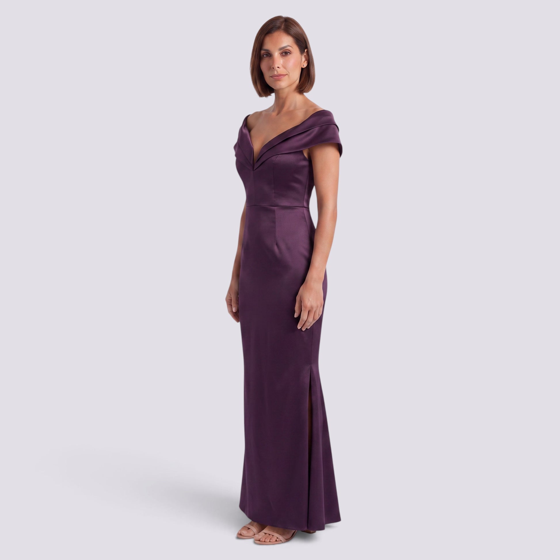 Essyro purple satin mermaid evening gown with an off-the-shoulder bardot neckline and side slit on a model