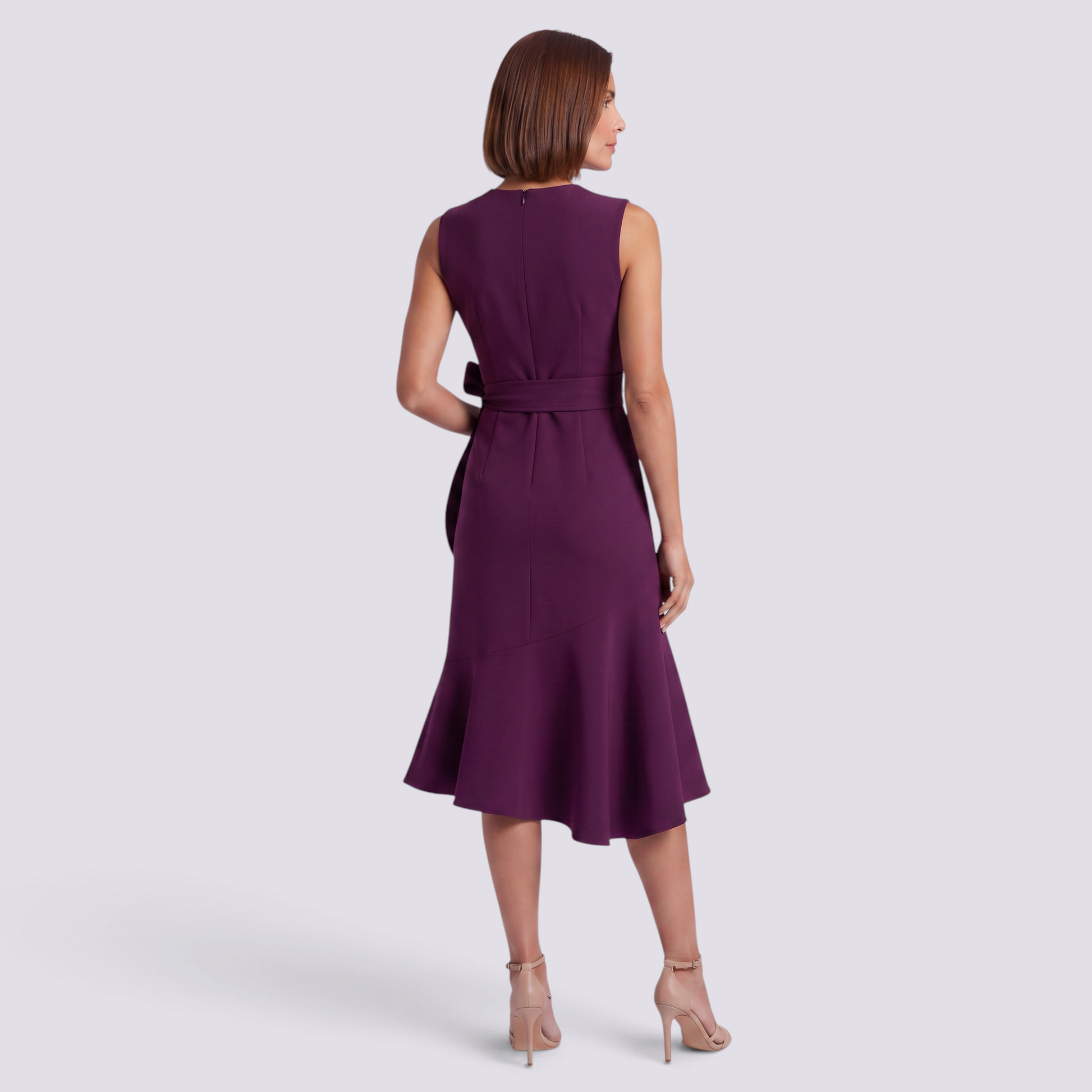 Essyro purple sleeveless midi dress with a round neckline and waist bow detail, shown from the back on a model.