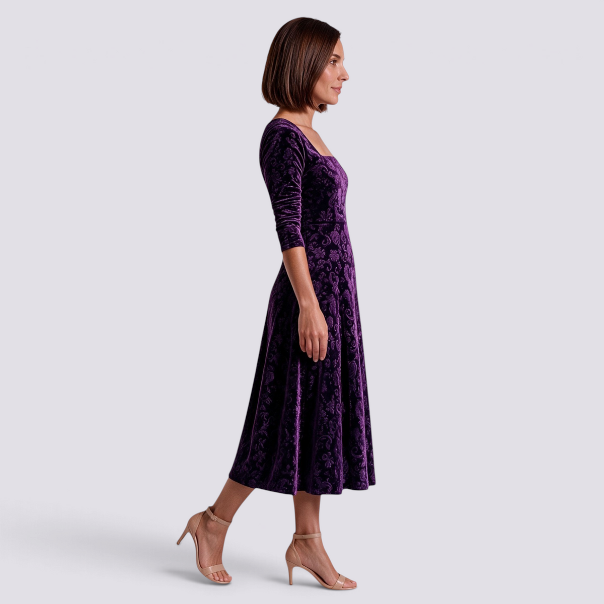 Essyro purple velvet midi dress with floral jacquard pattern, square neckline, and A-line skirt on a model