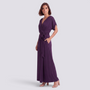 Essyro elegant deep purple plus size maxi dress with wrap design, short sleeves, and tie waist on a model