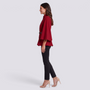 Essyro red batwing sleeve cape with mandarin collar and thin black belt worn by a model in profile view