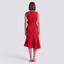 Essyro red sleeveless midi dress with a round neckline and bow detail at the waist, back view on a model.