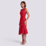 Essyro red sleeveless midi dress with a round neckline and a decorative waist bow, worn by a model.