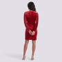 Essyro red velvet party dress with long sleeves and sequin detailing on the back, worn by a model in studio